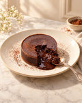 Chocolate lava cake cut open with molten chocolate center